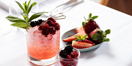 purezza cocktails with a bowl of fruit